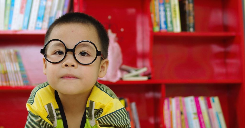 Smiling boy with sunglasses - speech therapy for kids