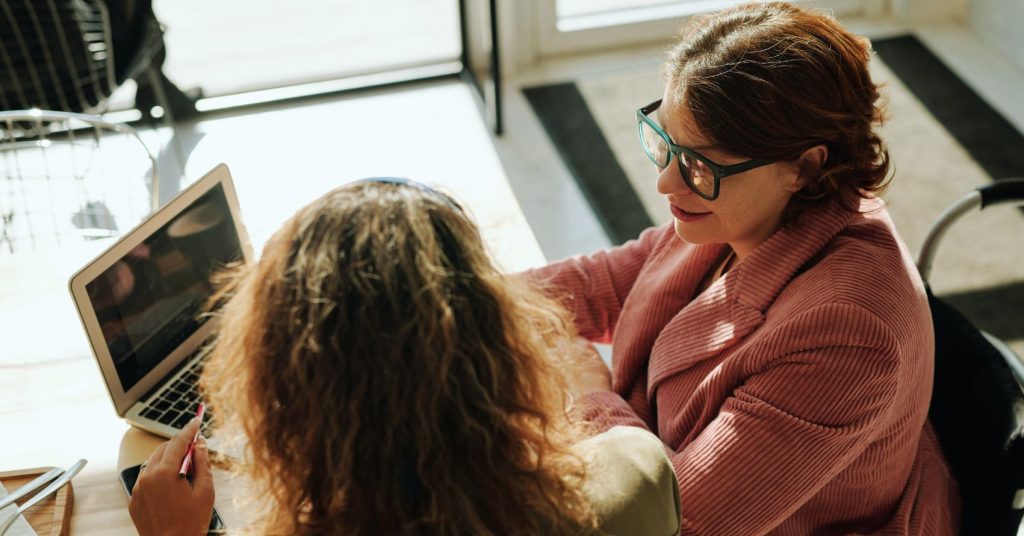 NDIS reports - 2 women chatting